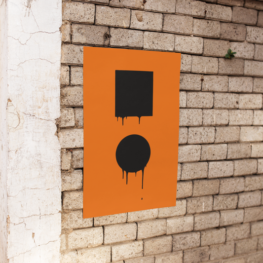 Orange poster with black abstract designs on a brick wall